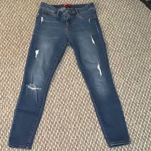 Dark blue jeans with rips